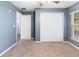 Bedroom features a large window, ceiling fan, carpeted floor, and double closet at 560 Hatchwood Dr, Haines City, FL 33844