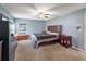 Comfortable bedroom featuring neutral walls, ceiling fan, and dark wood furniture at 560 Hatchwood Dr, Haines City, FL 33844