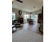 Inviting dining area with a fireplace, modern light fixture, and large windows at 5982 Crane Dr, Lakeland, FL 33809