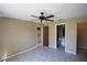 Neutral paint, ceiling fan, and tile flooring in bedroom at 6043 Topher Trl # 6043, Mulberry, FL 33860