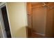 This is a small reach-in closet with shelves and hanging rods at 6043 Topher Trl # 6043, Mulberry, FL 33860