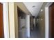 Hallway features in-unit laundry with stacked washer and dryer units at 6043 Topher Trl # 6043, Mulberry, FL 33860