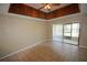 Living room features a decorative wood paneled ceiling and tile flooring at 6043 Topher Trl # 6043, Mulberry, FL 33860