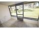 Enclosed and screened in patio overlooking landscaped exterior at 6043 Topher Trl # 6043, Mulberry, FL 33860