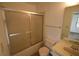 Standard bathroom with a tub/shower combo, frosted shower door and ample space at 6055 Topher Trl # 6055, Mulberry, FL 33860