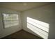 Well-lit carpeted bedroom with a window providing lots of natural light at 6055 Topher Trl # 6055, Mulberry, FL 33860