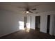 Carpeted bedroom featuring a ceiling fan, ensuite access, and plenty of natural light at 6055 Topher Trl # 6055, Mulberry, FL 33860