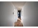 Long hallway featuring tile flooring and white walls throughout the home at 6055 Topher Trl # 6055, Mulberry, FL 33860