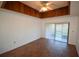 The living room features tiled floors, a ceiling fan, and sliding glass door to a porch at 6055 Topher Trl # 6055, Mulberry, FL 33860