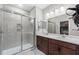 Bathroom featuring a glass shower, double sink vanity, and modern lighting at 6249 Great Bear Dr, Lakeland, FL 33805