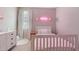 Cozy bedroom with a neon name, soft textures, and soothing color scheme at 6249 Great Bear Dr, Lakeland, FL 33805