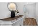 Foyer featuring hardwood floors and a decorative console table with mirror at 6249 Great Bear Dr, Lakeland, FL 33805