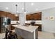 Well-equipped kitchen with stainless steel appliances, a center island, and stylish pendant lighting at 6249 Great Bear Dr, Lakeland, FL 33805