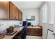 Home office featuring built-in cabinets, a desk, and a window for natural light at 6249 Great Bear Dr, Lakeland, FL 33805