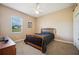 Bedroom featuring warm carpet, a window and a minimalist bed frame at 6339 Alamanda Hills Dr, Lakeland, FL 33813