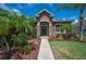 Inviting front entrance with stone accents and a well-landscaped garden at 6339 Alamanda Hills Dr, Lakeland, FL 33813