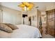 Main bedroom showcasing a traditional wood bed set with bathroom and kitchen entrance at 6339 Alamanda Hills Dr, Lakeland, FL 33813