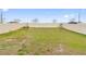 The lawn of this expansive fenced in back yard is ready for play at 645 Sarner Pass Way, Winter Haven, FL 33881