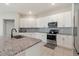 Bright kitchen with ample counter space, stainless steel appliances, and tile backsplash at 645 Sarner Pass Way, Winter Haven, FL 33881