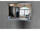 View of a kitchen with stainless steel refrigerator from another room at 6528 Shepherd Oaks Pass, Lakeland, FL 33811