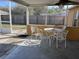 A partially covered patio with seating; great for relaxing outdoors at 6528 Shepherd Oaks Pass, Lakeland, FL 33811