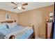 Inviting bedroom featuring neutral colors, a wood-frame bed, and soft, cozy bedding at 6792 Brentwood Ne Dr, Winter Haven, FL 33881