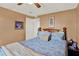 Relaxing bedroom with soft lighting, a comfortable bed, and a ceiling fan at 6792 Brentwood Ne Dr, Winter Haven, FL 33881