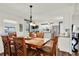 Dining area connects to kitchen featuring table, chairs and a chandelier at 6792 Brentwood Ne Dr, Winter Haven, FL 33881