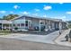 Charming single-story home featuring a covered carport, long driveway and manicured landscaping at 6792 Brentwood Ne Dr, Winter Haven, FL 33881