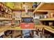 Well-organized shed interior with shelving, work bench and tool box at 6792 Brentwood Ne Dr, Winter Haven, FL 33881