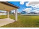 Spacious backyard with covered patio, perfect for outdoor entertaining or relaxing at 685 Meadow Pointe Dr, Haines City, FL 33844