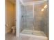 Modern bathroom features a glass-enclosed shower with tiled walls and updated fixtures at 685 Meadow Pointe Dr, Haines City, FL 33844