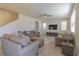 Inviting living room featuring neutral furniture, a large television, and ample natural light, creating a comfortable atmosphere at 685 Meadow Pointe Dr, Haines City, FL 33844