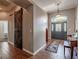 Inviting foyer features wood floors, a stylish barn door, and elegant lighting fixtures at 7104 Lake Eaglebrooke Way, Lakeland, FL 33813