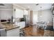 Bright kitchen featuring stainless steel appliances, granite countertops, and adjacent dining area at 7104 Lake Eaglebrooke Way, Lakeland, FL 33813