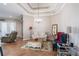 Comfortable living room featuring stylish furniture, wood floors, and elegant lighting at 7104 Lake Eaglebrooke Way, Lakeland, FL 33813