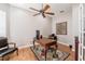 Well-lit home office with classic desk and chair at 7104 Lake Eaglebrooke Way, Lakeland, FL 33813