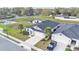 Aerial view of home with pond, and palm tree landscaping at 7187 Cruz Ct, Lakeland, FL 33813