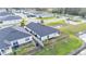 Aerial view of backyard with fenced yard and neighborhood pond at 7187 Cruz Ct, Lakeland, FL 33813