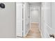 Hallway with wooden floors and views into other rooms at 7187 Cruz Ct, Lakeland, FL 33813