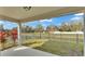 Covered patio with a view of the backyard and pond at 7187 Cruz Ct, Lakeland, FL 33813