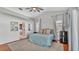 Bedroom with ceiling fan, windows, and a view of a bathroom at 7321 Gunstock Dr, Lakeland, FL 33809