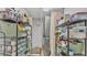 Well-organized pantry with shelving units, providing ample storage for food and household supplies at 7321 Gunstock Dr, Lakeland, FL 33809