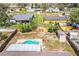 Aerial view of home's backyard, featuring a small pool and wooden fence at 7997 Kaitlin Cir, Lakeland, FL 33810