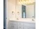 Bathroom featuring dual sink vanity, vanity mirror, and neutral walls at 7997 Kaitlin Cir, Lakeland, FL 33810