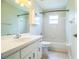 This bathroom features a shower-tub combo and a vanity with storage at 7997 Kaitlin Cir, Lakeland, FL 33810