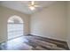 Bedroom featuring laminate flooring, window, neutral walls, and ceiling fan at 7997 Kaitlin Cir, Lakeland, FL 33810