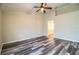 Bright bedroom with modern flooring, ceiling fan and an ensuite bathroom at 7997 Kaitlin Cir, Lakeland, FL 33810