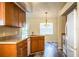 Bright kitchen featuring wood cabinetry, durable counters, and stainless steel appliances at 7997 Kaitlin Cir, Lakeland, FL 33810