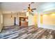 Living room featuring modern floors, ceiling fan and open concept floor plan at 7997 Kaitlin Cir, Lakeland, FL 33810